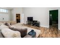 Spacious living room with plush sectional sofa and wood floors at 18940 Emerald Ridge Dr, Hudson, FL 34667