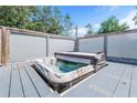 Relaxing hot tub on a private deck with wood privacy screens at 18940 Emerald Ridge Dr, Hudson, FL 34667