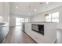 Modern kitchen features an island with a microwave, sink, and breakfast bar at 5530 N 9Th St # 5, Tampa, FL 33604