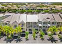 Aerial view of waterfront townhomes with parking at 549 Bahia Beach Blvd, Ruskin, FL 33570