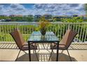 Waterfront balcony with table and chairs, offering scenic water views at 549 Bahia Beach Blvd, Ruskin, FL 33570