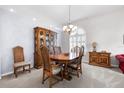 Formal dining room with wood table and hutch at 35506 Wickingham Ct, Zephyrhills, FL 33541