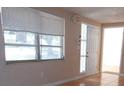 Bright living room with large window and tile floors at 7101 Green St, New Port Richey, FL 34652