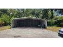 Metal carport providing covered parking at 4375 Lindsey Loop, Dover, FL 33527