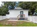 Charming studio with a fenced backyard, patio, and steps leading to the entrance at 4622 Paloverde Dr, New Port Richey, FL 34652
