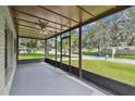 Spacious screened porch overlooking the neighborhood at 7024 Filbert Ln, Tampa, FL 33637