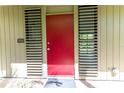 Red front door with louvered sides and a welcome mat at 758 Pine Run Dr # 758, Osprey, FL 34229