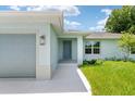 Front view of the house showcasing light gray siding at 10317 Gulfstream Blvd, Englewood, FL 34224
