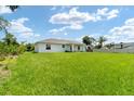 Large backyard with green grass at 10317 Gulfstream Blvd, Englewood, FL 34224