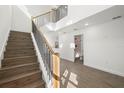 Modern staircase with wood and metal railings leading to upper level at 7422 S 34Th Ave, Tampa, FL 33619