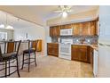 Kitchen features granite countertops, updated cabinetry, and tile flooring at 2285 Israeli Dr # 29, Clearwater, FL 33763