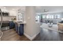 Modern kitchen with stainless steel appliances and blue cabinetry at 4141 Bayshore Blvd # 1003, Tampa, FL 33611