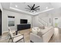 Bright and airy living room with large sectional sofa and built-in entertainment center at 1039 Seagrape Dr, Ruskin, FL 33570