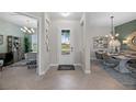 Bright and spacious entryway, offering views into dining area and office at 14434 Amestoy Ave, Port Charlotte, FL 33981