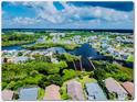 Aerial view of waterfront community with lush vegetation at 4548 Dewey Dr, New Port Richey, FL 34652