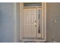 Beige front door with sidelights and keypad entry at 568 Shoreham Ne Ct, St Petersburg, FL 33716