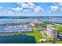 Aerial view of waterfront community with marina and high-rise building at 130 Riviera Dunes Way # 403, Palmetto, FL 34221