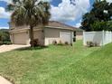 Backyard of a house with a white fence at 10308 Holland Rd, Riverview, FL 33578
