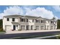 Exterior view of five-unit townhome building with two-car garages at 3508 White Dandelion Ct, Plant City, FL 33565