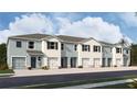 Exterior view of five-unit townhome building with two-car garages at 3508 White Dandelion Ct, Plant City, FL 33565