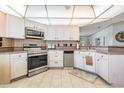 Kitchen showcases stainless steel appliances and ample countertop space at 5733 Pawnee St, Zephyrhills, FL 33542