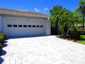 Clean paved driveway leading to the garage at 2501 Lonigan Pl, Sun City Center, FL 33573