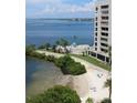 Stunning aerial view of waterfront property with private beach and resort-style pool at 6009 Sea Ranch Dr # 705, Hudson, FL 34667