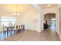 Bright dining room with hardwood floors and chandelier at 3524 Beaumont Loop, Spring Hill, FL 34609