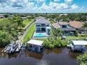 Modern home with pool and private dock on canal at 519 Treviso Dr, Apollo Beach, FL 33572