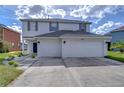 Two story house with a two car garage and nicely landscaped yard at 20131 Nob Oak Ave, Tampa, FL 33647