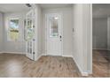 Bright entryway with tile floors and french doors at 20315 Symphony Pl, Venice, FL 34293