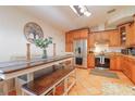 Eat-in kitchen with stainless steel appliances and wood cabinets at 4504 Horseshoe Pick Ln, Valrico, FL 33594