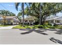 Home exterior showcasing a classic bungalow style with a welcoming front porch at 2010 W Dekle Ave, Tampa, FL 33606
