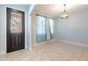 Bright dining area with tile floors and light blue walls at 7110 N Taliaferro Ave, Tampa, FL 33604