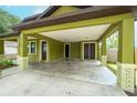 Covered carport with attached garage, offering ample parking and storage at 7110 N Taliaferro Ave, Tampa, FL 33604