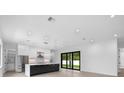 Modern kitchen with large island and stainless steel appliances at 5341 Lake Pearl Ct, Tampa, FL 33625