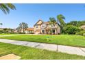 Two-story house with a fire hydrant and palm trees at 17809 Saint Lucia Isle Dr, Tampa, FL 33647