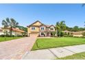 Two-story house with a landscaped lawn and palm trees at 17809 Saint Lucia Isle Dr, Tampa, FL 33647