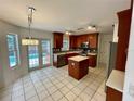 Kitchen with island, stainless steel appliances, and access to pool at 4031 Quail Briar Dr, Valrico, FL 33596