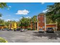 Apartment building exterior with ample parking and landscaping at 4207 S Dale Mabry Hwy # 8304, Tampa, FL 33611