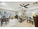 Bright and airy living room with a dining area and ample natural light at 329 Grayston Pl # 112, Sun City Center, FL 33573