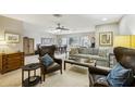 Cozy living room featuring leather armchairs and a neutral color scheme at 329 Grayston Pl # 112, Sun City Center, FL 33573