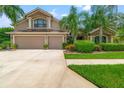 Charming two story home with manicured lawn and a two car garage at 15407 Azra Dr, Odessa, FL 33556