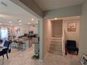 Open concept kitchen and living area with an island, stainless steel appliances, and a dining area at 10066 Corso Milano Dr, Tampa, FL 33625