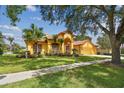 Gorgeous home with a well-manicured lawn at 9223 Highland Ridge Way, Tampa, FL 33647