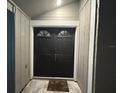 Inviting entryway with double doors and tiled flooring at 4509 Tidal Pond Rd, New Port Richey, FL 34652