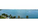Waterfront view with sailboats and palm trees at 707 S Gulfstream Ave # 602, Sarasota, FL 34236