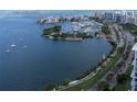 Aerial view showcasing a marina, waterfront, and city skyline at 707 S Gulfstream Ave # 602, Sarasota, FL 34236