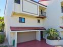 Two-story townhome with attached garage and balcony at 240 Windward Psge # 605, Clearwater Beach, FL 33767