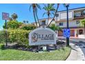 Entrance sign for the Village on Island Estates community in Windward Passage at 240 Windward Psge # 605, Clearwater Beach, FL 33767
